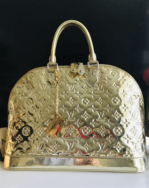 louis vuitton bag with gold plate